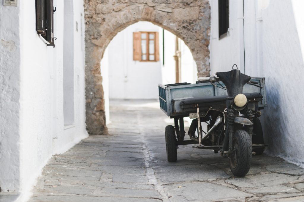 A moped in one of the narrow streets of the Greek town of Lindos, Rhodes - from travel blog: http://Epepa.eu
