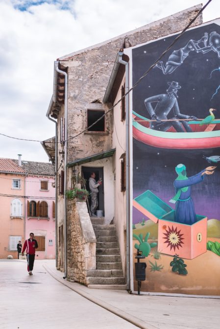 Colorful large mural on the wall of a stone building in the old city of Vodnjan, Istria, Croatia